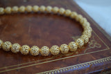 Golden Filigree Bead Necklace